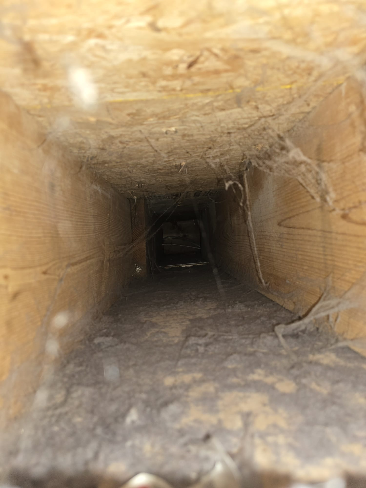 Air duct vent clogged with dust and debris before cleaning
