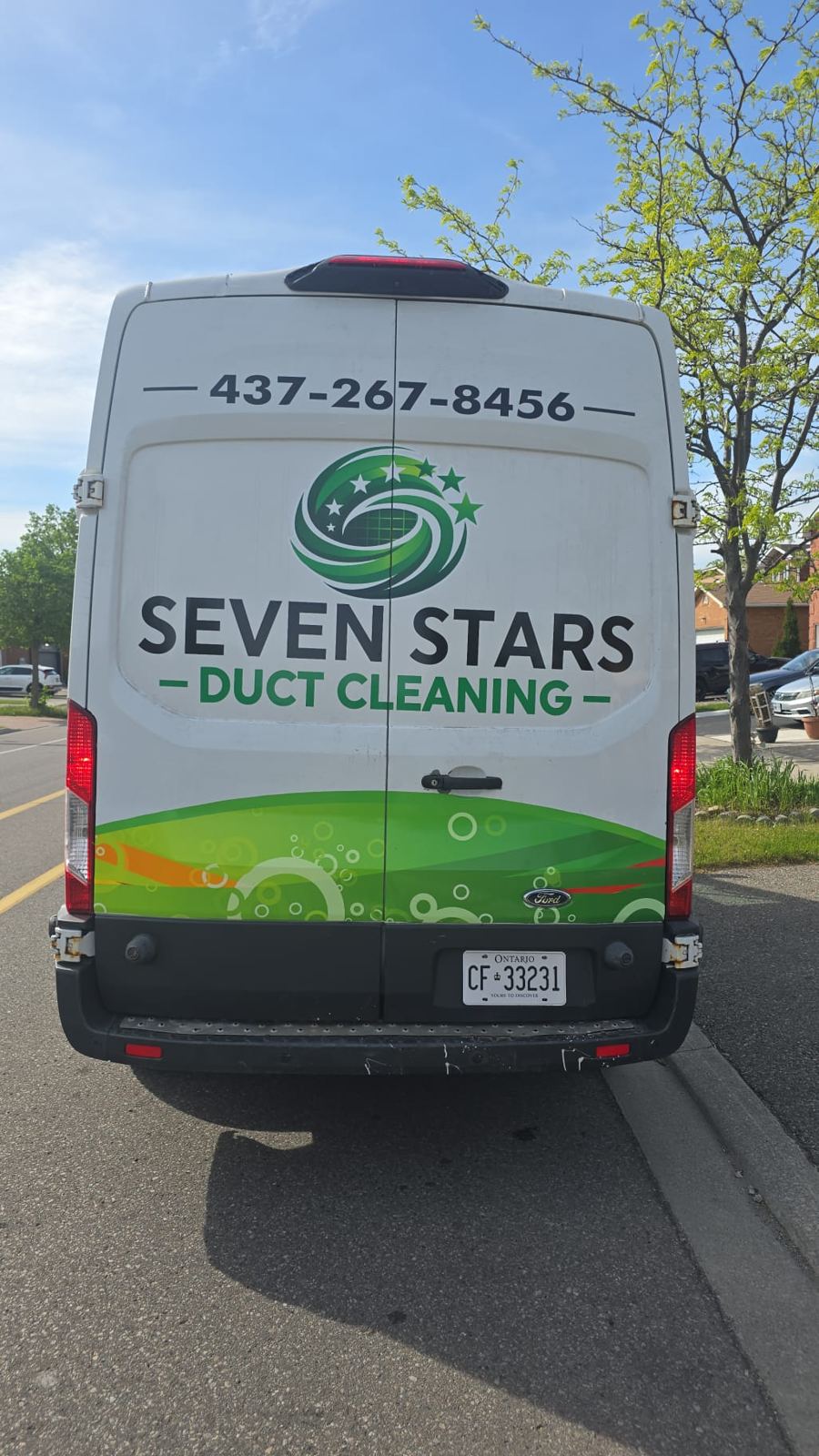 Rear view of Seven Stars Duct Cleaning van with Ontario plates and phone 437-267-8456