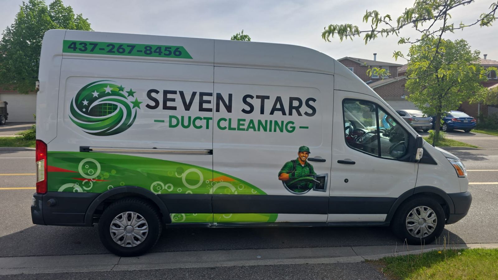 Seven Stars Duct Cleaning Ford Transit van — full side profile with green branding and 437-267-8456